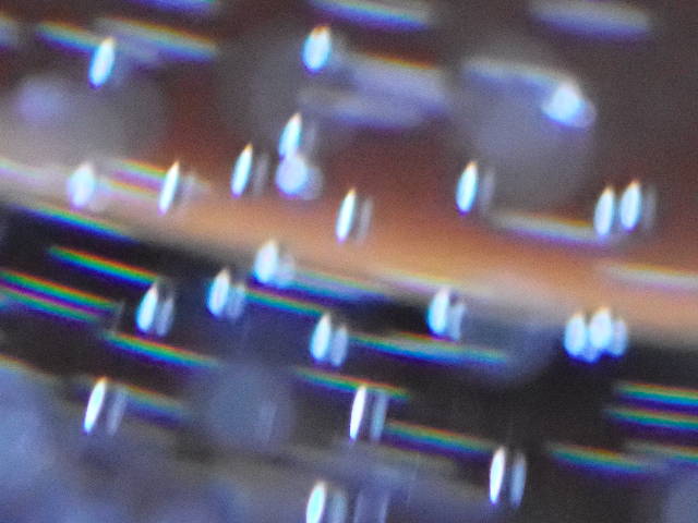 abstract photo of bubbles and reflections through water glass