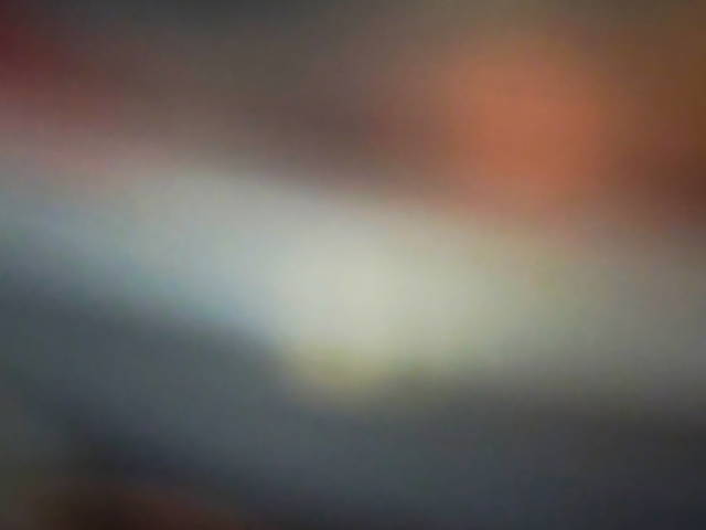 abstract blurred photo depicting copper, black, and light grey gradients