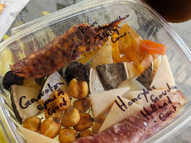 photo of container of cheese snack tray with names of cheeses for future reference