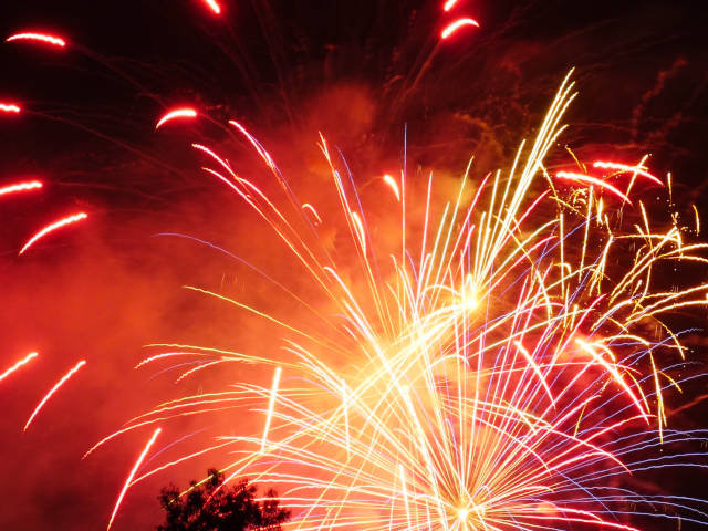 photo of a red fireworks bursting in air
