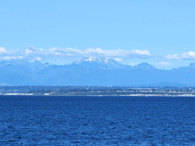 distant mountain range seen across open ocean waters