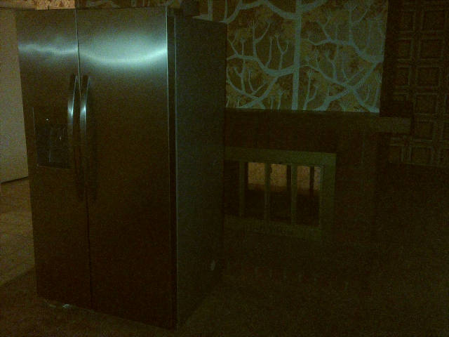 refrigerator goes in front of the fireplace
