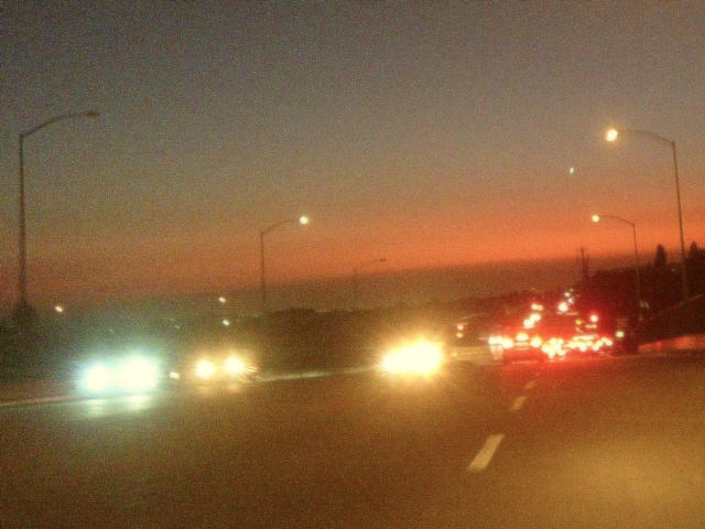 driving on a friday night into the sunset