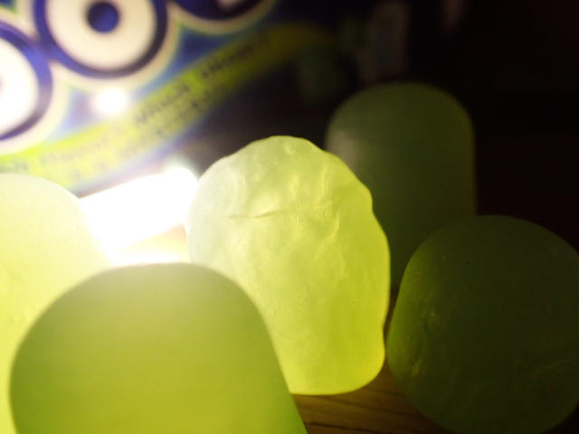 ghost shaped green candy backlit and glowy