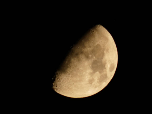 the moon just over half full