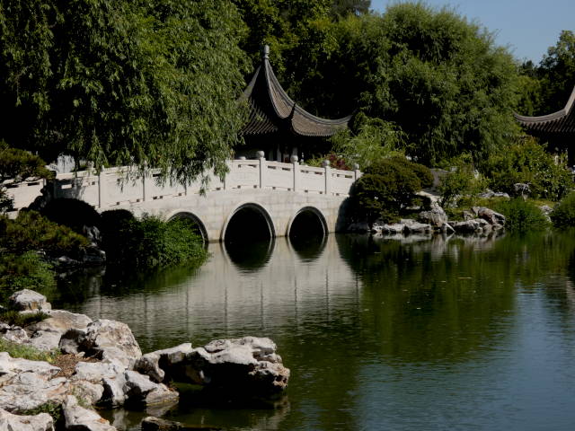 bridge over pond with reflections
