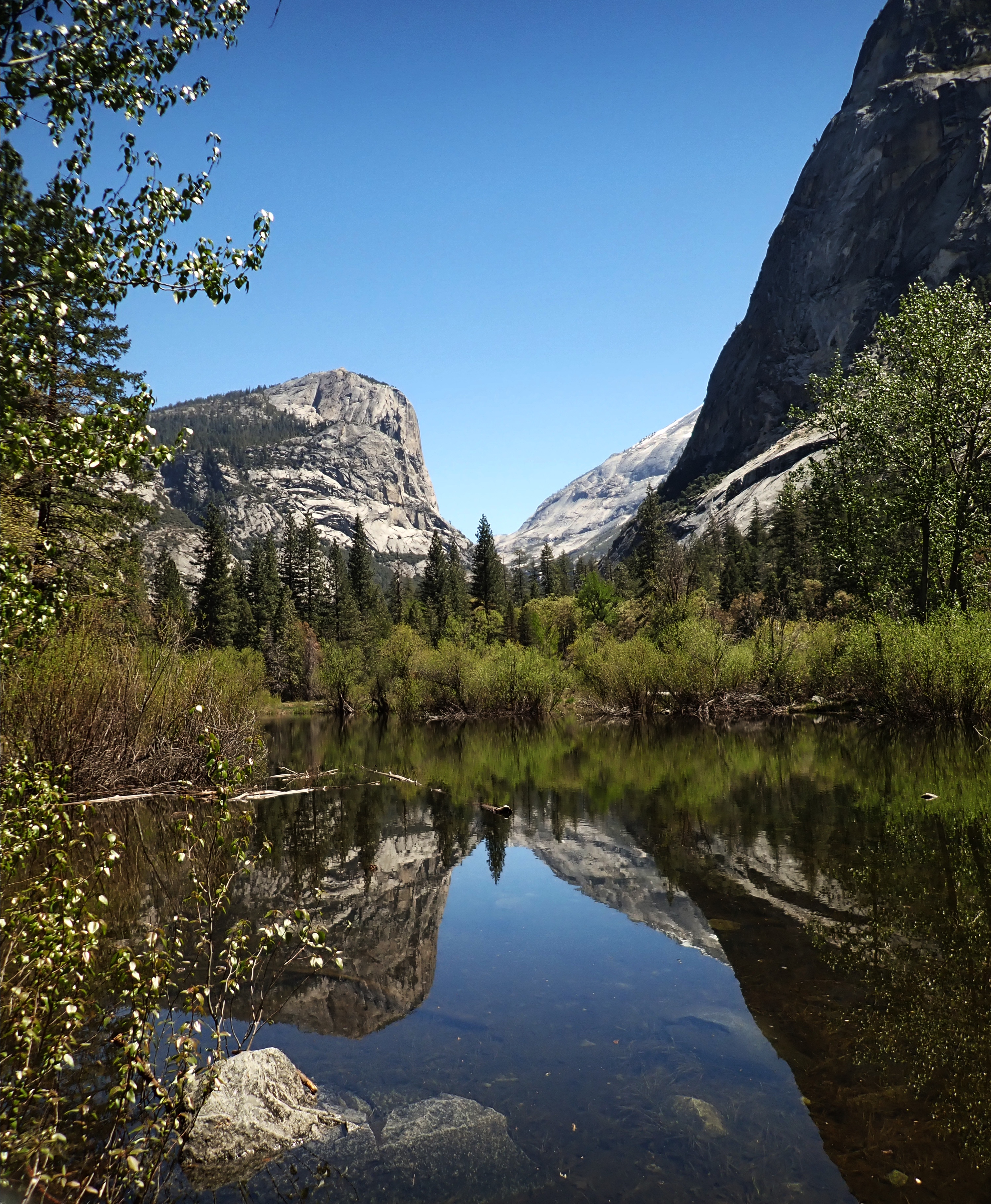 Reflections of mountains on the surface of mirror lake in Yosemite Valley
